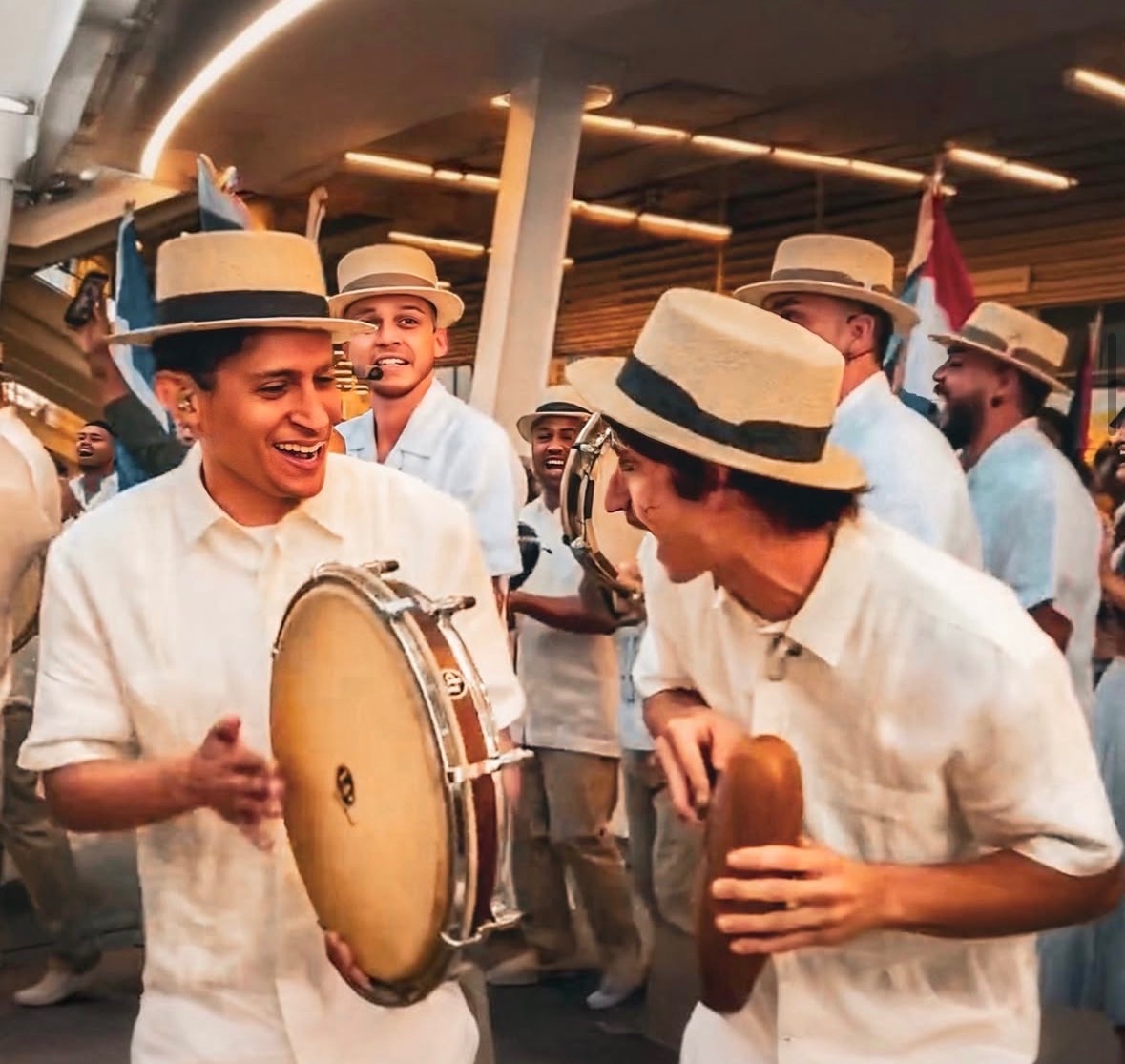 Benjamin Henry Schultz performing Plena alongside Willy Calderon and Los Pleneros de La Cresta outside Levi Stadium