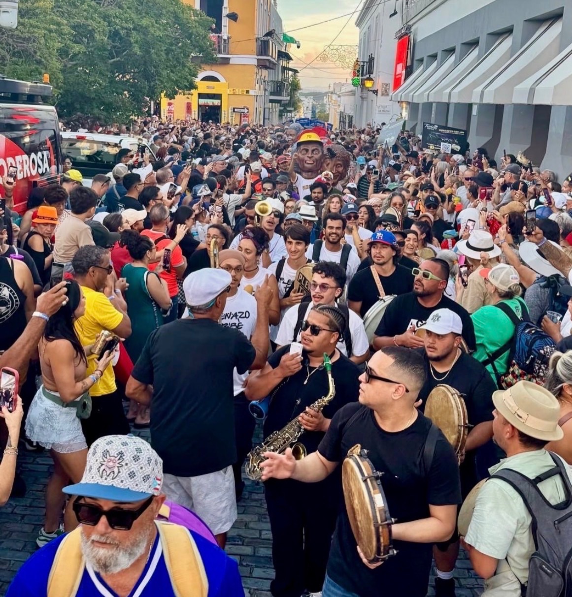 Benjamin Henry Schultz performing Plena at La Calle San Sebastián alongside Plenazo Tribe and Llonsi Martínez